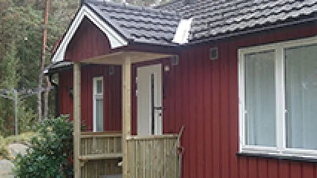 Rød fasade på trehus